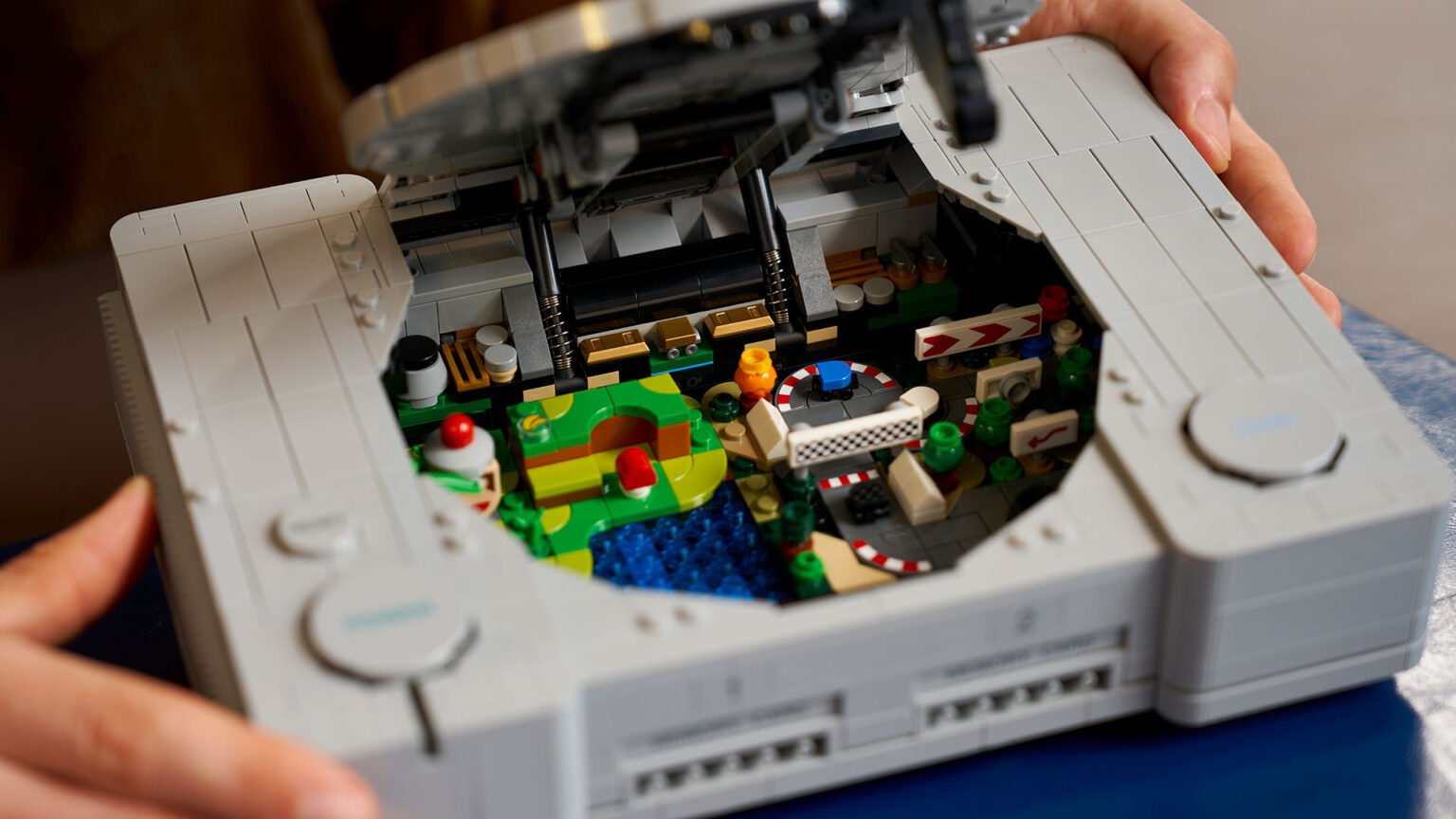 The LEGO PlayStation opens up to reveal Gran Turismo and Ape Escape dioramas | Image: The LEGO Group The LEGO PlayStation opens up to reveal Gran Turismo and Ape Escape dioramas | Image: The LEGO Group
